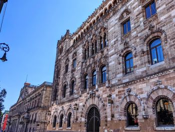 Low angle view of old building against sky