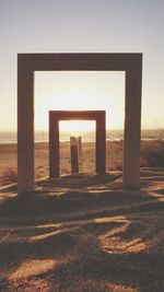 Scenic view of beach against sky during sunset