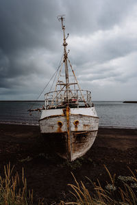 Boat in sea against sky