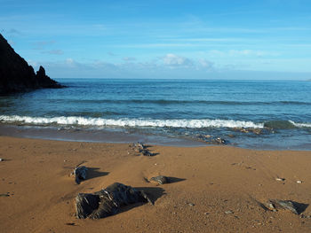 Scenic view of beach against sky