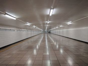 Empty illuminated underground walkway