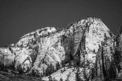 Low angle view of rock formation against clear sky