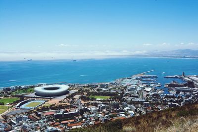 View of cityscape against blue sky