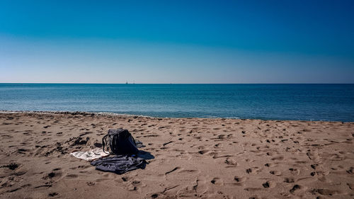 Scenic view of sea against clear blue sky