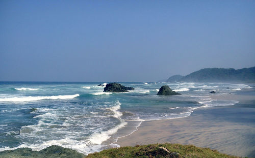 Scenic view of sea against clear sky