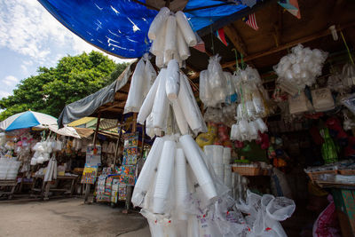 Clothes hanging at market stall