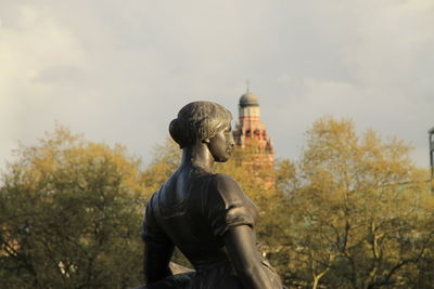 Low angle view of statue against building