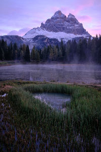 Scenic view of lake and mountains against sky