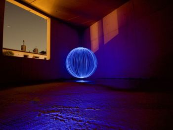 Light painting on wall in illuminated building