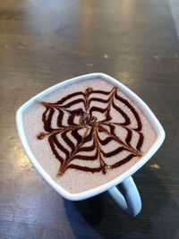 High angle view of cappuccino on table