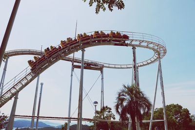 Low angle view of rollercoaster against clear sky