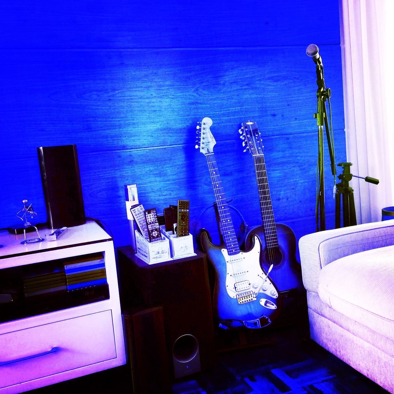 VIEW OF GUITAR AT HOME AGAINST BLUE SKY