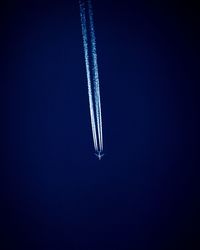 Low angle view of airplane flying in sky