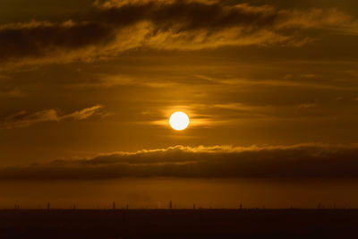 Scenic view of silhouette landscape against sky during sunrise 