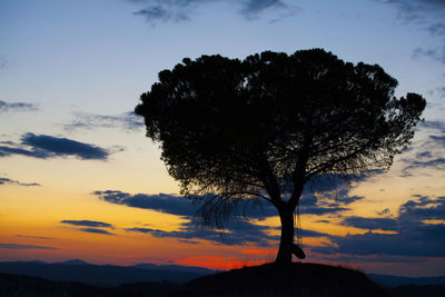 Silhouette tree against sky during sunset