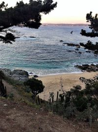 Scenic view of sea against sky at sunset