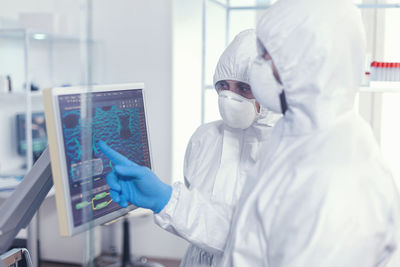 Rear view of scientist working in laboratory