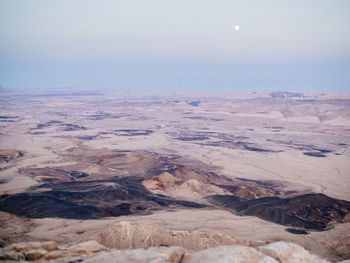 Scenic view of dramatic landscape against sky during sunrise