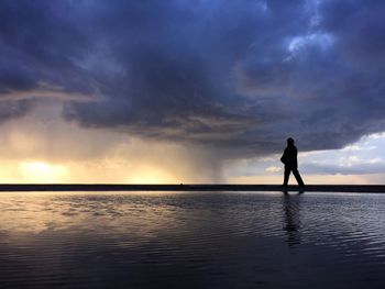 Scenic view of sea against cloudy sky