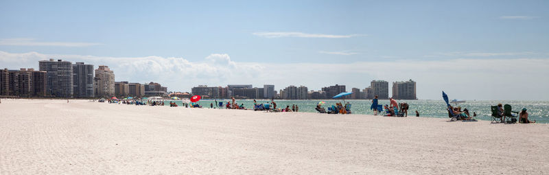 Panoramic view of beach and buildings against sky