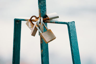 Close-up of padlocks on railing