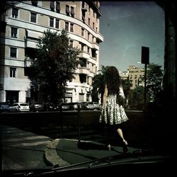 Woman walking on city street