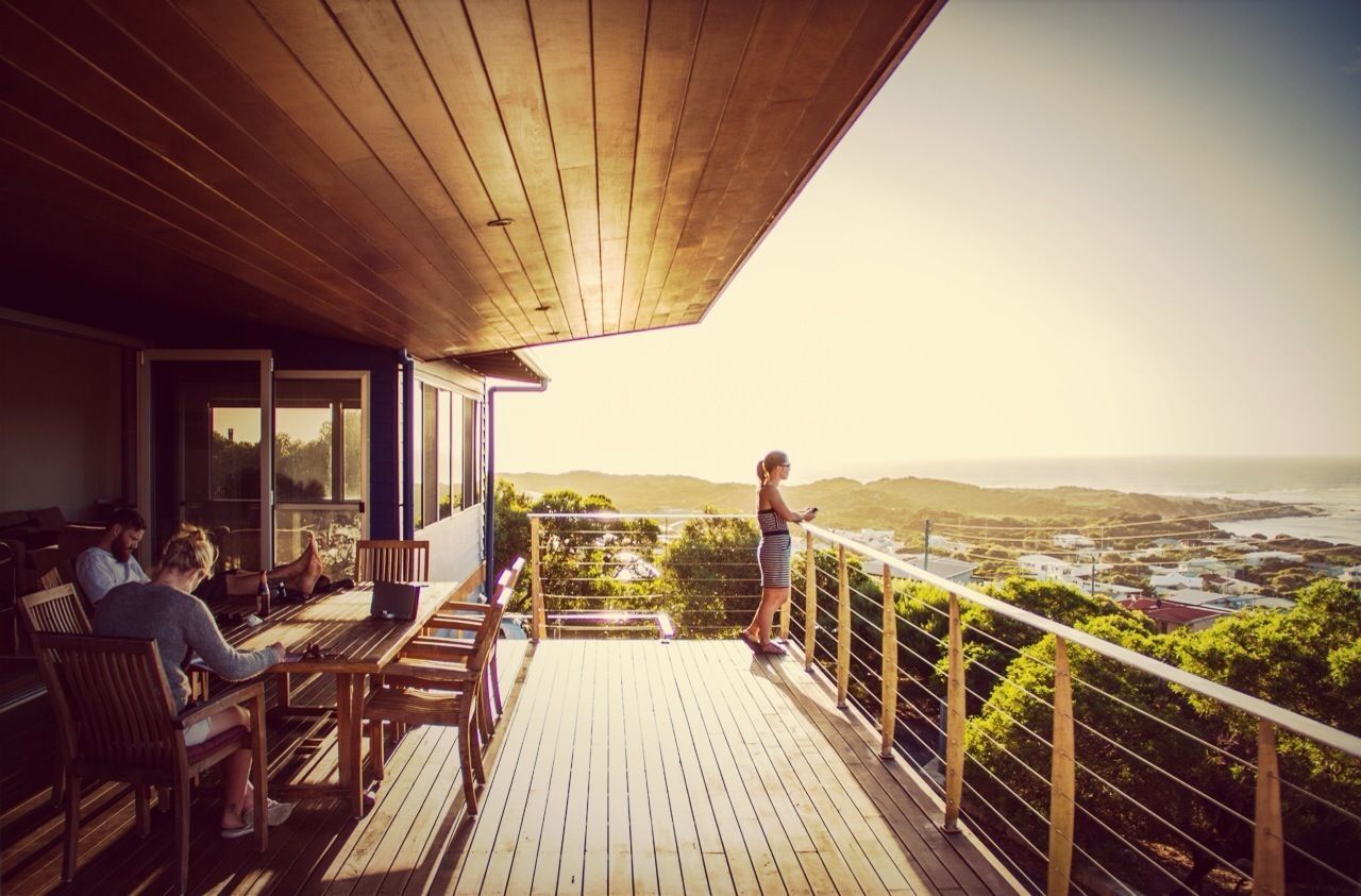 built structure, architecture, railing, indoors, chair, empty, absence, clear sky, table, sunlight, day, bench, the way forward, sea, sky, horizon over water, shadow, seat, tranquility, nature