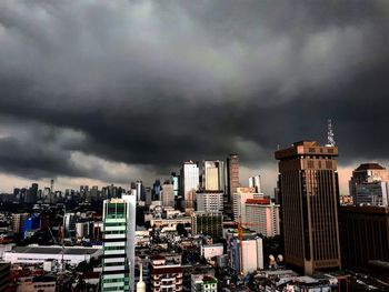 Cityscape against storm clouds