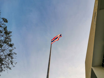 Low angle view of flag against sky