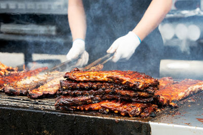 Barbecue ribs and chicken on the grill at a summer festival