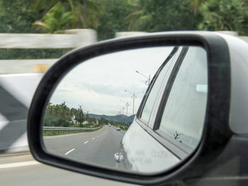 Reflection of car on side-view mirror