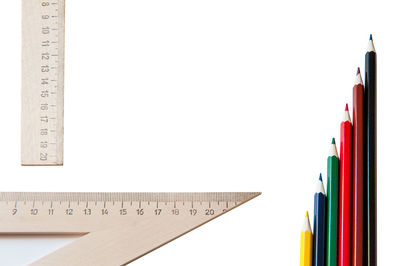 Close-up of colored pencils against white background