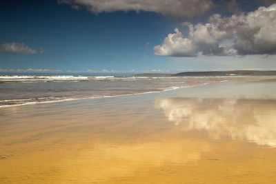 Scenic view of beach against sky