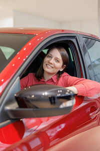 Side view of woman in car