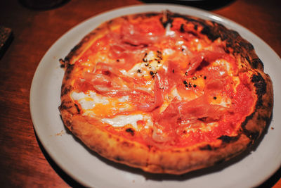 High angle view of pizza in plate on table