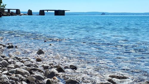 Scenic view of sea against clear sky