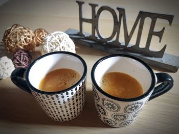 High angle view of coffee cups on table