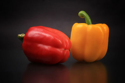 Close-up of bell peppers against black background