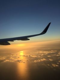 Airplane flying over dramatic sky