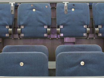 Close-up of chairs in row