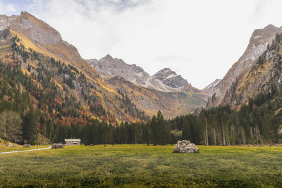 Scenic view of landscape and mountains against sky