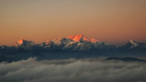 Scenic view of mountains against sky during sunset