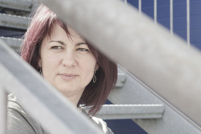 Close-up of smiling woman looking away