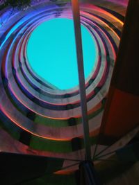 Low angle view of spiral staircase at night