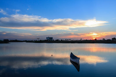 Scenic view of lake against sky during sunset