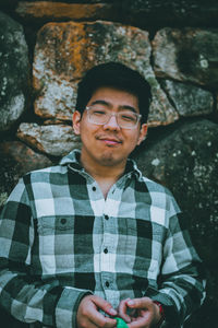 Portrait of young man wearing eyeglasses