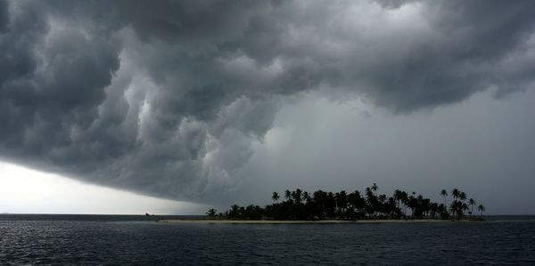 Scenic view of sea against cloudy sky