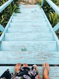 Low section of person standing on staircase