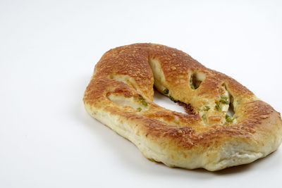 Close-up of bread against white background