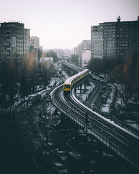 High angle view of buildings in city during winter